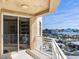 Condo balcony featuring stunning city and water views and a white railing at 11 San Marco St # 807, Clearwater Beach, FL 33767