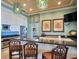 Stylish bar area featuring granite counters, modern appliances, and ample cabinet space at 11 San Marco St # 807, Clearwater Beach, FL 33767