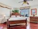 Bright bedroom featuring a four poster bed, large window with natural light at 11 San Marco St # 807, Clearwater Beach, FL 33767