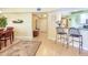 Open-concept dining area with breakfast bar seamlessly connects to the living spaces with plenty of natural light at 11 San Marco St # 807, Clearwater Beach, FL 33767