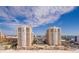 Luxury beachfront condo building with lush landscaping, and a gorgeous community pool at 11 San Marco St # 807, Clearwater Beach, FL 33767
