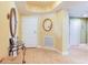 Bright foyer features glass table and mirrors with hardwood flooring at 11 San Marco St # 807, Clearwater Beach, FL 33767