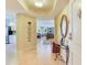 Inviting foyer leads to a spacious living area with a modern kitchen and a cozy sitting area at 11 San Marco St # 807, Clearwater Beach, FL 33767