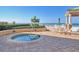 A hot tub is surrounded by lush landscaping overlooking the beach at 11 San Marco St # 807, Clearwater Beach, FL 33767