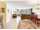 Open-concept living space with couches, a dining area, and natural light at 11 San Marco St # 807, Clearwater Beach, FL 33767