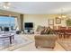 A spacious living room with a balcony overlooking the ocean and comfortable seating at 11 San Marco St # 807, Clearwater Beach, FL 33767