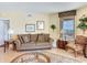Comfortable living room with a cozy sofa, side tables and a view of the water at 11 San Marco St # 807, Clearwater Beach, FL 33767