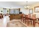 A spacious living room with a dining area and a balcony with an ocean view at 11 San Marco St # 807, Clearwater Beach, FL 33767
