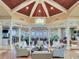 Grand lobby area with high ceilings, statement chandelier and comfortable seating arrangements at 11 San Marco St # 807, Clearwater Beach, FL 33767
