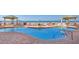 A spacious outdoor swimming pool with chairs, tables, and ocean view at 11 San Marco St # 807, Clearwater Beach, FL 33767