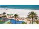 Lounge by the beautiful pool with beach and ocean views at 11 San Marco St # 807, Clearwater Beach, FL 33767