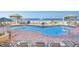 Resort style pool with lounge chairs, umbrellas, and ocean views at 11 San Marco St # 807, Clearwater Beach, FL 33767