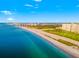 Breathtaking aerial shot displaying the coastline, turquoise waters, and the city skyline in the distance at 1170 Gulf Blvd # 2001, Clearwater, FL 33767