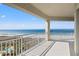 Expansive balcony view overlooking the ocean, beach, and lush landscaping. Ideal for relaxation and enjoying the scenery at 1170 Gulf Blvd # 2001, Clearwater, FL 33767