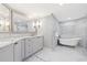 The luxurious bathroom showcases a soaking tub, marble countertops, and elegant fixtures for a spa-like experience at 1170 Gulf Blvd # 2001, Clearwater, FL 33767