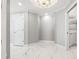 Hallway with luxury marble flooring and crown molding at 1170 Gulf Blvd # 2001, Clearwater, FL 33767