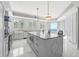 Bright kitchen featuring marble countertops, stainless steel appliances, and ocean views at 1170 Gulf Blvd # 2001, Clearwater, FL 33767