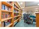 Cozy library features floor-to-ceiling bookshelves with a comfortable reading nook at 1170 Gulf Blvd # 2001, Clearwater, FL 33767