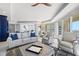 Inviting living room with ocean view balcony access, and open floor plan to dining room and kitchen at 1170 Gulf Blvd # 2001, Clearwater, FL 33767
