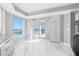 Living Room featuring floor-to-ceiling windows with water views and luxury marble flooring at 1170 Gulf Blvd # 2001, Clearwater, FL 33767