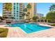 Beautiful community pool surrounded by lush landscaping and resort style amenities at 1170 Gulf Blvd # 2001, Clearwater, FL 33767