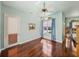 Sun-filled room with hardwood floors and a large window, showcasing ample natural light at 12333 Woodlands Cir, Dade City, FL 33525