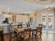 View of the dining table that opens to the kitchen and pool area at 12333 Woodlands Cir, Dade City, FL 33525