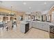 Bright kitchen view with white countertops and cabinets that open up to a dining area at 12333 Woodlands Cir, Dade City, FL 33525