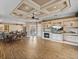 Open-concept living area with fireplace, built-ins, and patio access at 12333 Woodlands Cir, Dade City, FL 33525