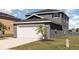A charming two-story home with a two-car garage and attractive exterior at 1308 22Nd E St, Palmetto, FL 34221