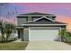 Charming two-story home with a two-car garage and well-maintained landscaping at 1308 22Nd E St, Palmetto, FL 34221