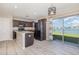 Modern kitchen with granite countertops, stainless steel appliances, and a view of the lake at 1308 22Nd E St, Palmetto, FL 34221