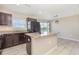 Open kitchen with an island, granite countertops, and stainless steel appliances at 1308 22Nd E St, Palmetto, FL 34221