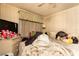 Cozy bedroom features wood-paneled walls and needs decluttering and modernization at 13225 101St St # 462, Largo, FL 33773