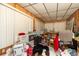A cluttered bedroom with wood-paneled walls and an outdated ceiling at 13225 101St St # 462, Largo, FL 33773