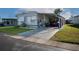Charming single-story home features a carport, well-maintained lawn, and a welcoming facade at 13225 101St St # 462, Largo, FL 33773