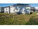 Exterior of a one-story home with a grassy lawn at 13225 101St St # 462, Largo, FL 33773