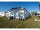 Exterior of a one-story home featuring a grassy lawn at 13225 101St St # 462, Largo, FL 33773