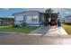 Charming single-story home features a carport, well-maintained lawn, and a welcoming facade at 13225 101St St # 462, Largo, FL 33773