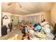 A cluttered living room featuring personal items, needs decluttering and updating at 13225 101St St # 462, Largo, FL 33773