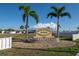 Four Seasons Estates sign with lush landscaping and bright blue skies. Resident Owned Community at 13225 101St St # 462, Largo, FL 33773
