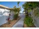 Beautifully landscaped walkway with mature palms leading to a gated community entrance at 13225 101St St # 462, Largo, FL 33773