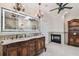 An exquisite bathroom with a fireplace, chandelier, dual vanity, and a large, illuminated mirror at 1336 51St Ne Ave, St Petersburg, FL 33703