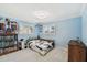 Cozy bedroom with blue walls, natural light, and ample storage space at 1336 51St Ne Ave, St Petersburg, FL 33703