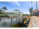 View of a private boat lift with a boat and kayak on the water at 1336 51St Ne Ave, St Petersburg, FL 33703