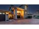Nighttime view of home exterior highlighting a grand entryway and manicured landscaping at 1336 51St Ne Ave, St Petersburg, FL 33703
