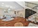 Elegant foyer featuring hardwood floors, a compass rose inlay, and a staircase at 1336 51St Ne Ave, St Petersburg, FL 33703