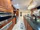 Spacious kitchen with stainless steel appliances, granite counters, and cabinetry plus a long granite island at 1336 51St Ne Ave, St Petersburg, FL 33703