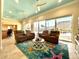 Bright living room with ceiling fans, large windows, and plush seating at 1336 51St Ne Ave, St Petersburg, FL 33703