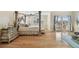 Bright main bedroom featuring a four-poster bed, dresser, and balcony access at 1336 51St Ne Ave, St Petersburg, FL 33703